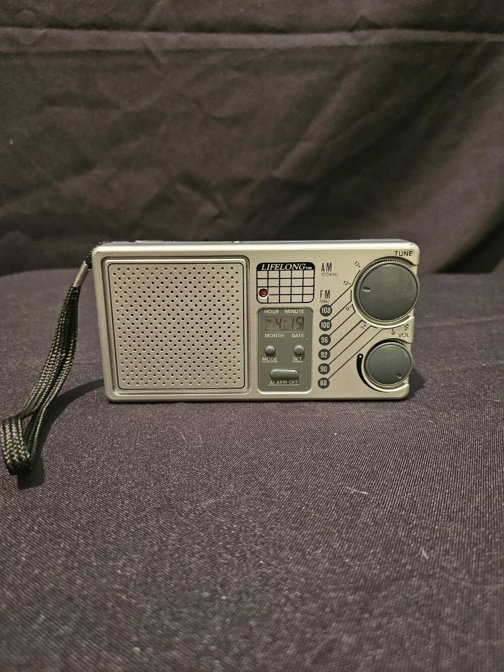 Vintage Lifelong Portable AM FM Radio Model 845 with an LCD alarm clock. Works